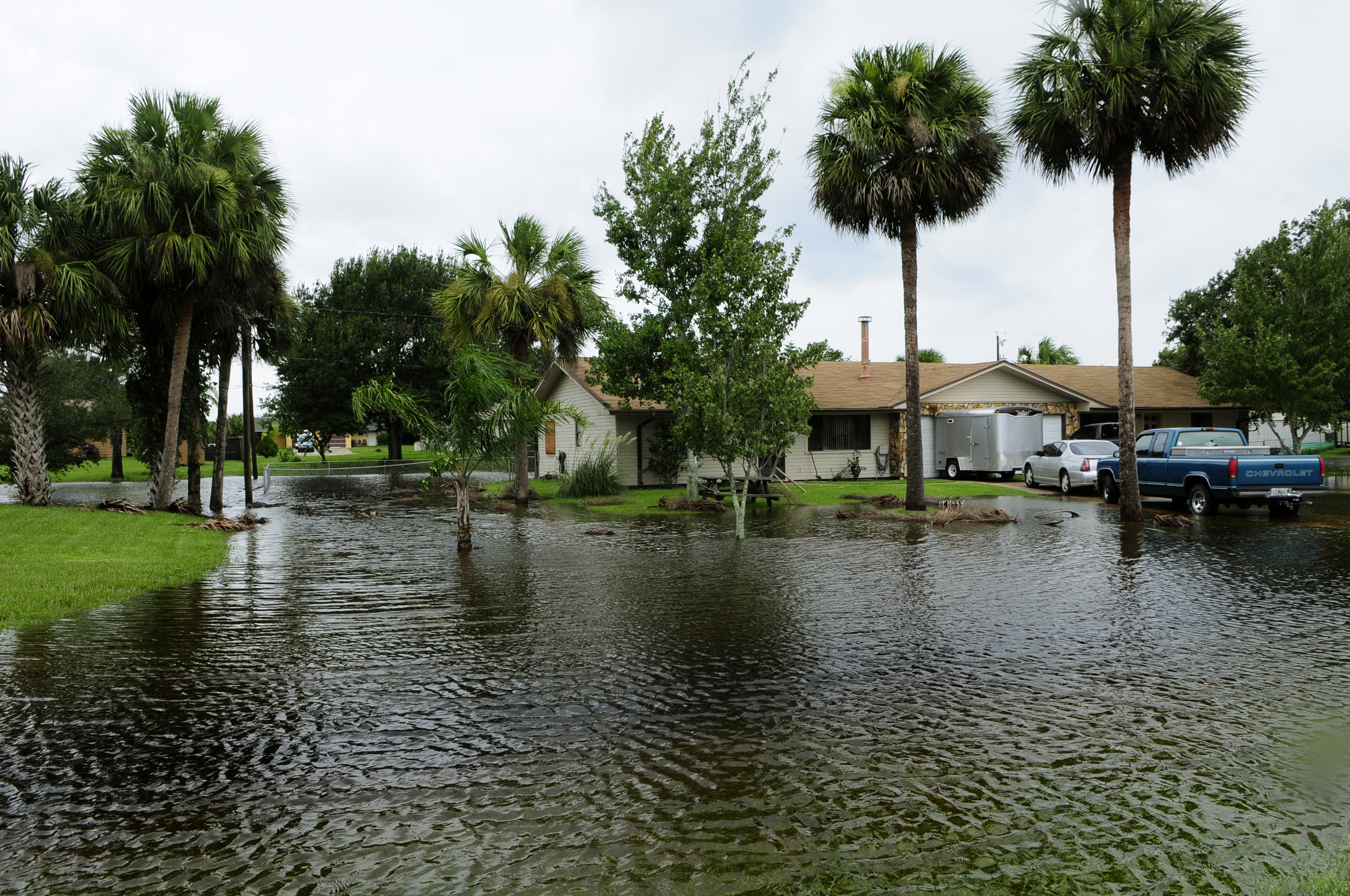 Community flooding in Florida with submerged homes and vehicles